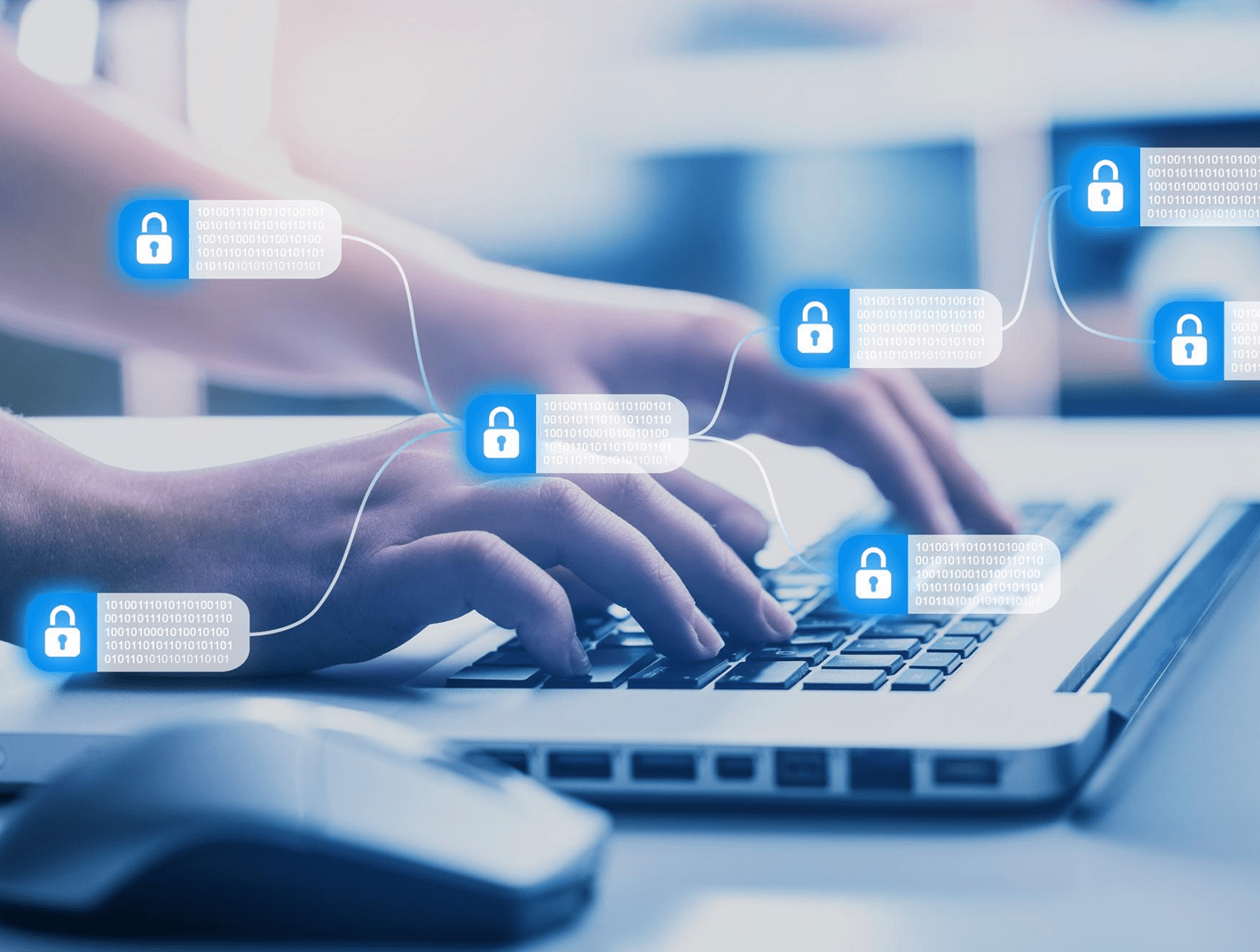 pair of hands typing on a laptop keyboard with security lock graphics