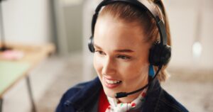 young smiling woman on headset