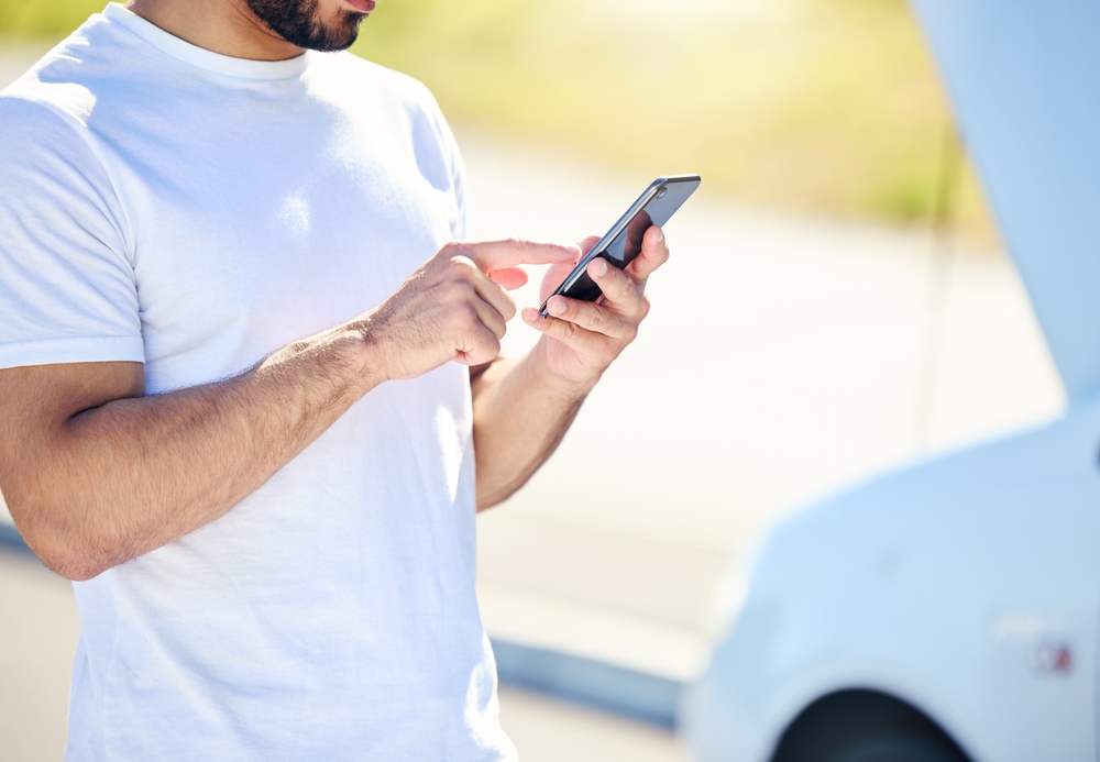 man using AI voice agent for roadside assistance