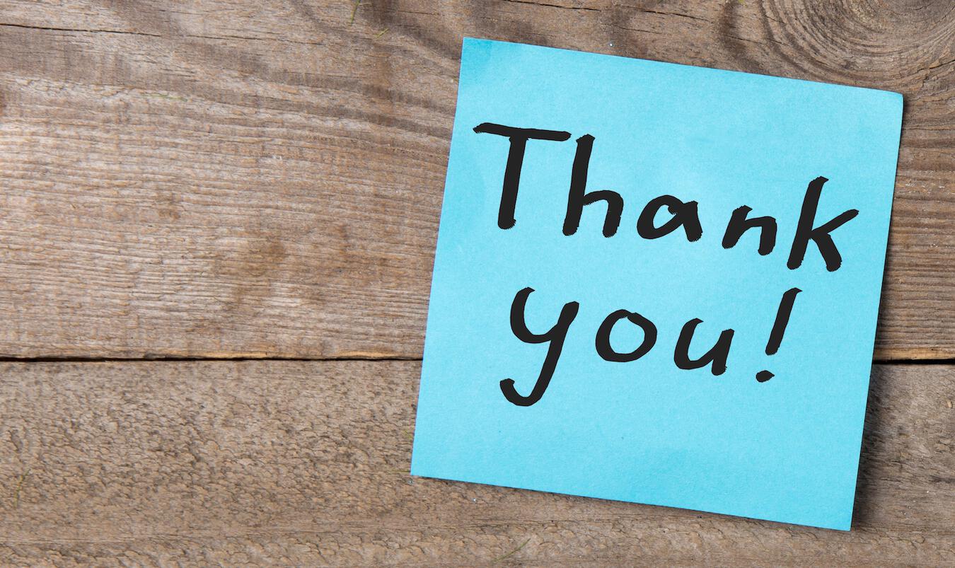 "thank you" on blue sticky note